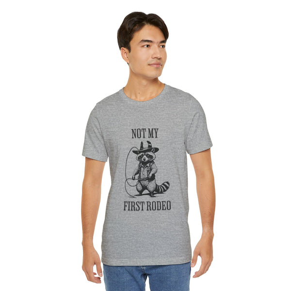 Not My First Rodeo Cowboy Raccoon Shirt, Funny Western Graphic Cotton Tee, Cute Quirky Country Style T-Shirt for Rodeo Fans & Animal Lovers
