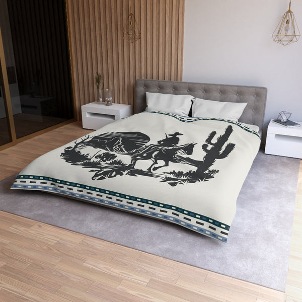 A beige duvet cover with a western theme, featuring an illustration of a cowboy on a horse, displayed on a bed in a stylishly decorated bedroom.