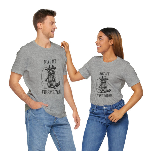 Not My First Rodeo Cowboy Raccoon Shirt, Funny Western Graphic Cotton Tee, Cute Quirky Country Style T-Shirt for Rodeo Fans & Animal Lovers