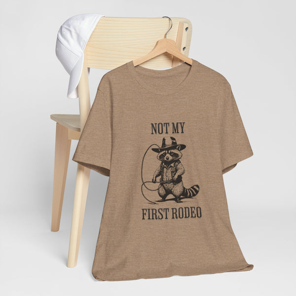 Not My First Rodeo Cowboy Raccoon Shirt, Funny Western Graphic Cotton Tee, Cute Quirky Country Style T-Shirt for Rodeo Fans & Animal Lovers